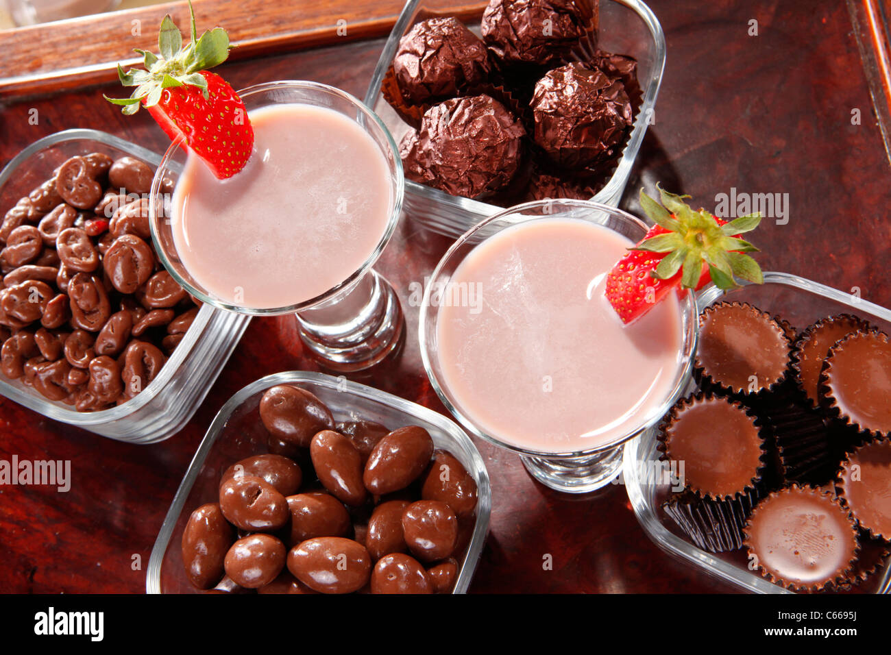 Chocolate cream liquor and assorted cocoa treats Stock Photo