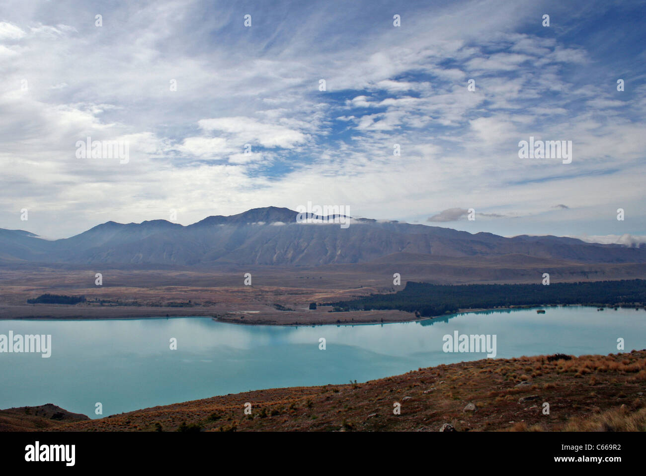 Looking over Lake Pukaki to the Mount Cook Road, north of Twizel, South Island, New Zealand Stock Photo