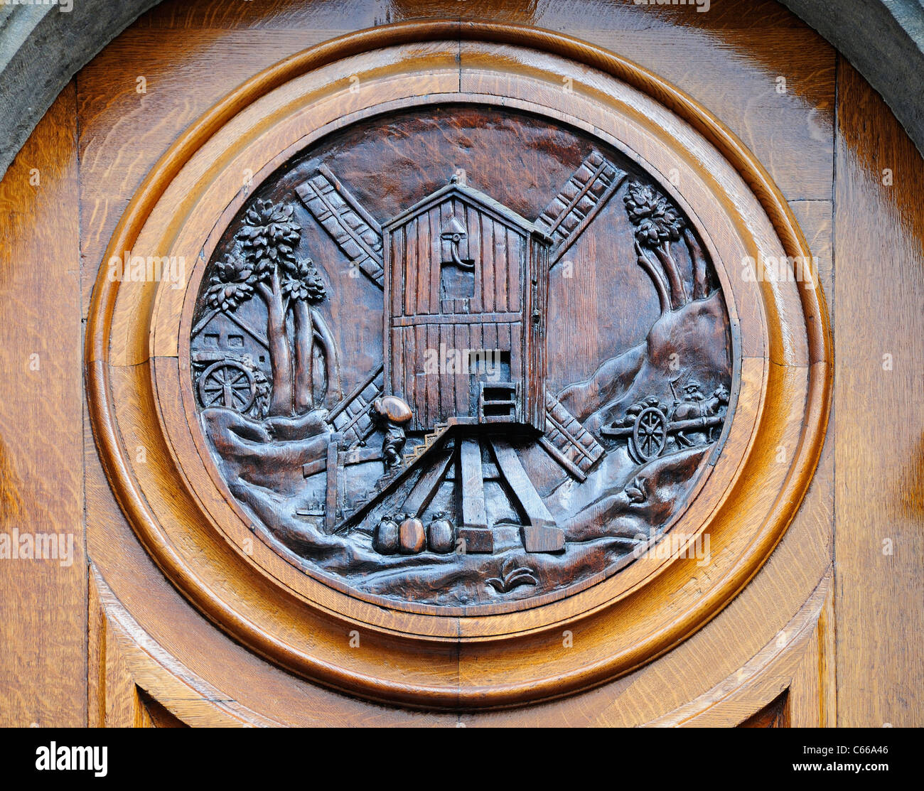 Brussels, Belgium. Grand Place. La Maison des Ducs de Brabant (1696-98) Detail of wooden door showing windmill Stock Photo