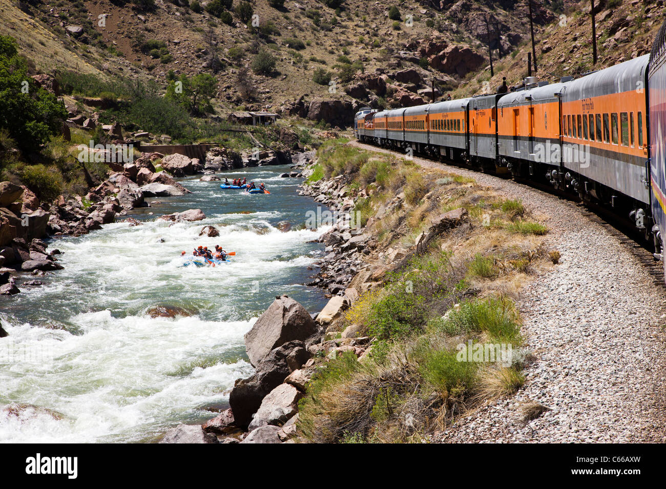 Popular tourist train runs through the 1,000' deep Royal Gorge Route along the Arkansas River, Central Colorado, USA Stock Photo
