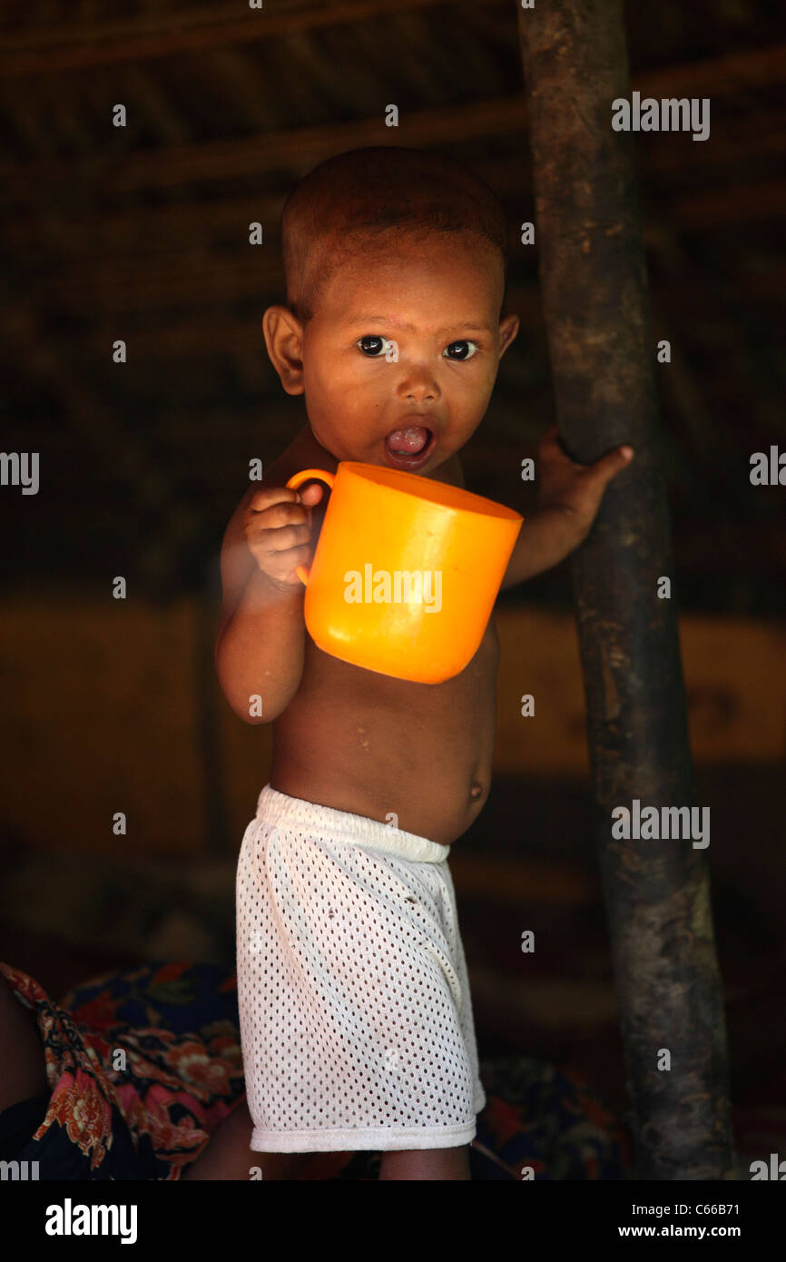 Aborigine child in a village, Taman Negara rainforest, Malaysia Stock Photo