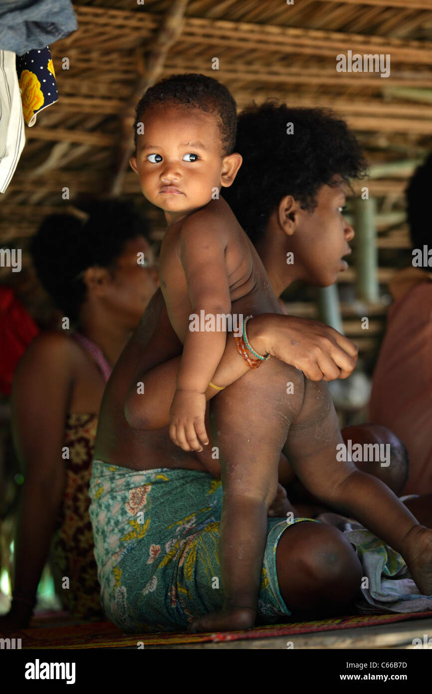 Aborigine family in a village, Taman Negara rainforest, Malaysia Stock Photo