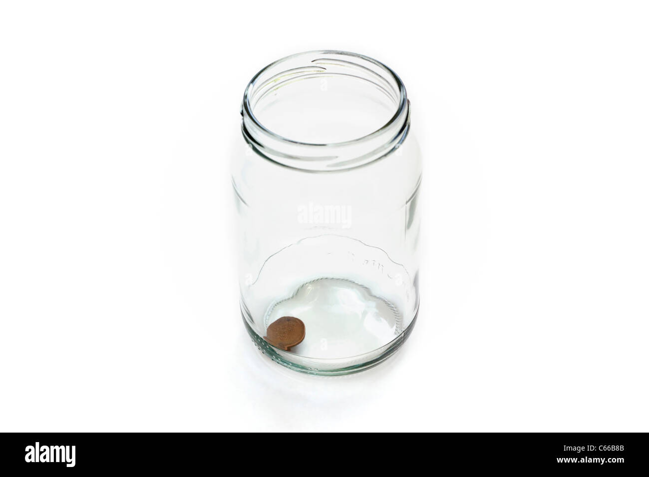 Money jar with one penny left Stock Photo