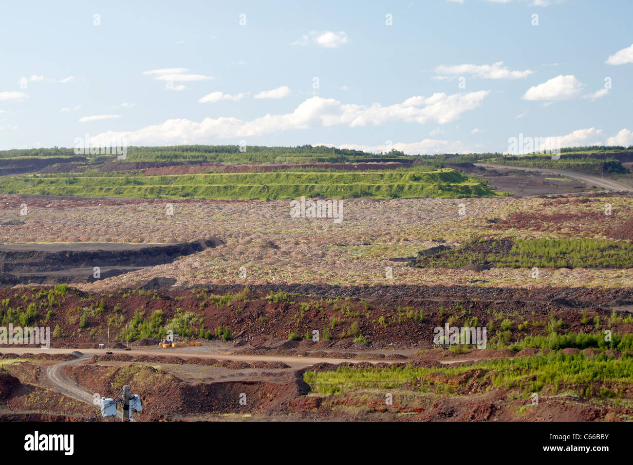 Hull–Rust–Mahoning Open Pit Iron Mine, reclaimation area restores slope and vegetation. Stock Photo