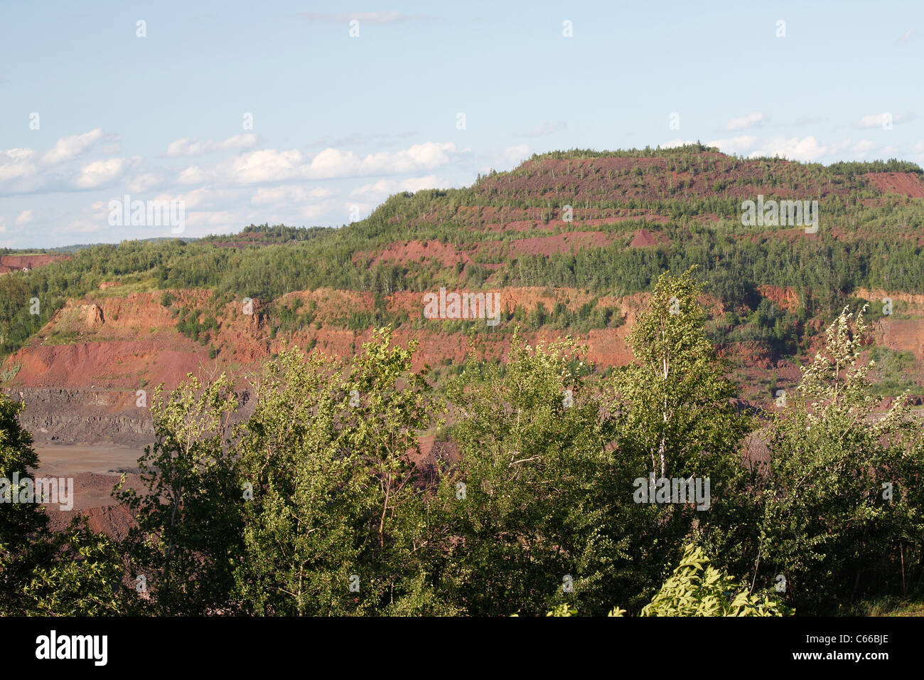 Hull–Rust–Mahoning Open Pit Iron Mine, older portion of mine showing vegetation regrowth Stock Photo
