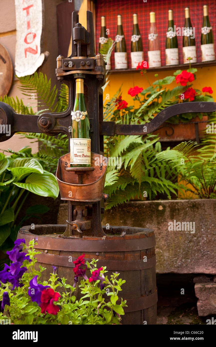 Antique wine bottle cork press in Ribeauville, Alsace Haut-Rhin France Stock Photo