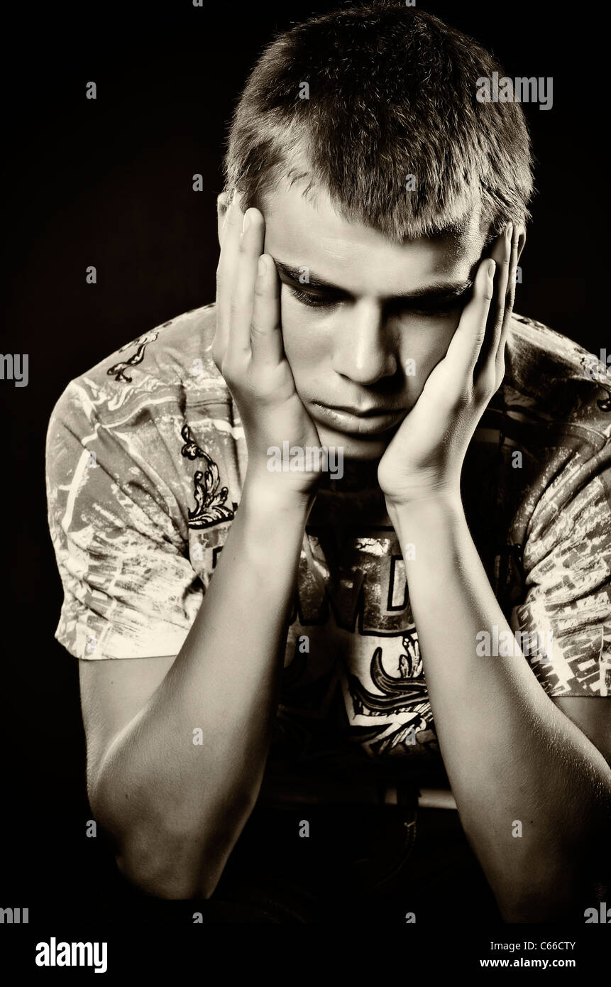 Dark portrait of hopeless teenager Stock Photo