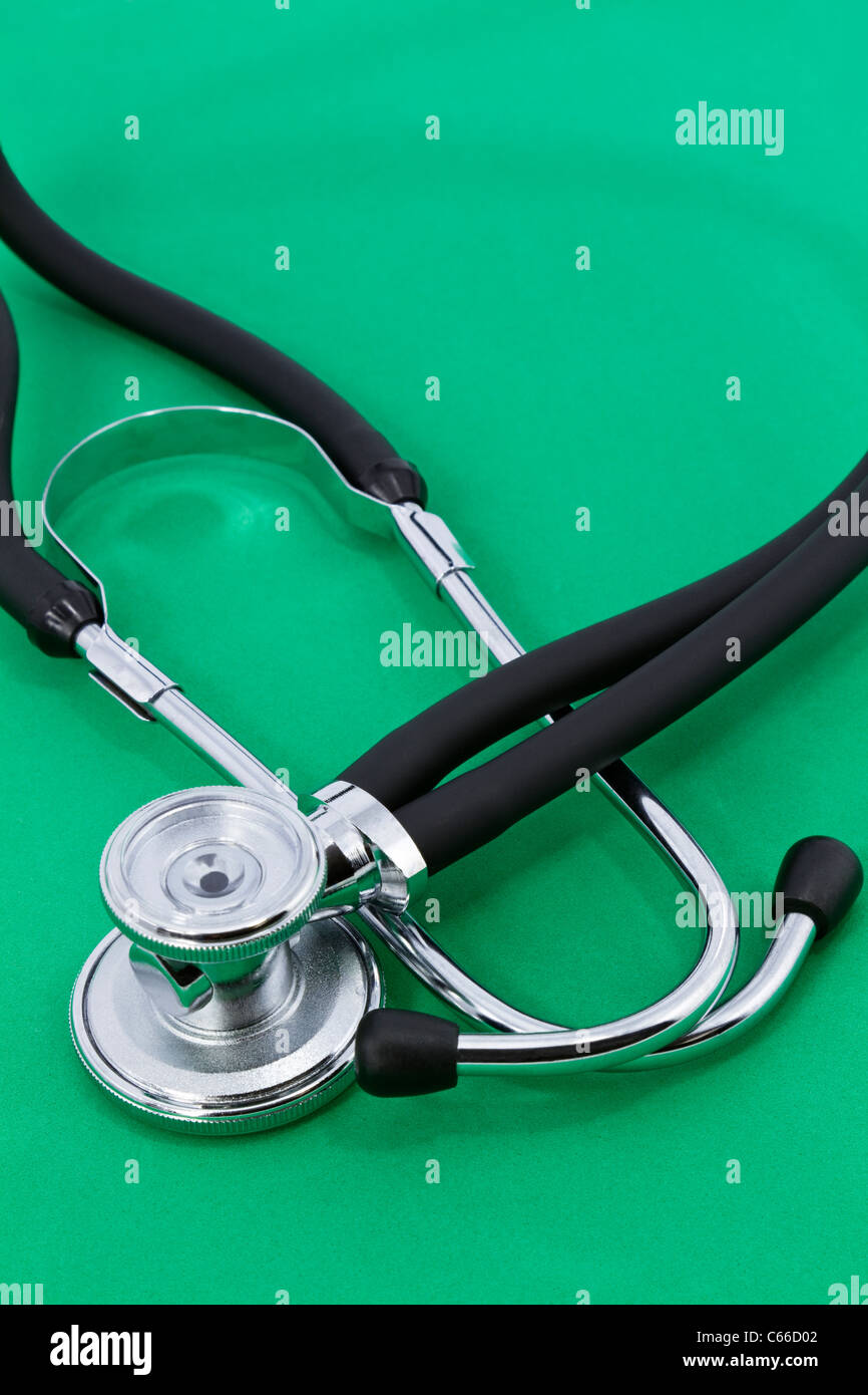 Medical stethoscope on green background; copy space available Stock ...