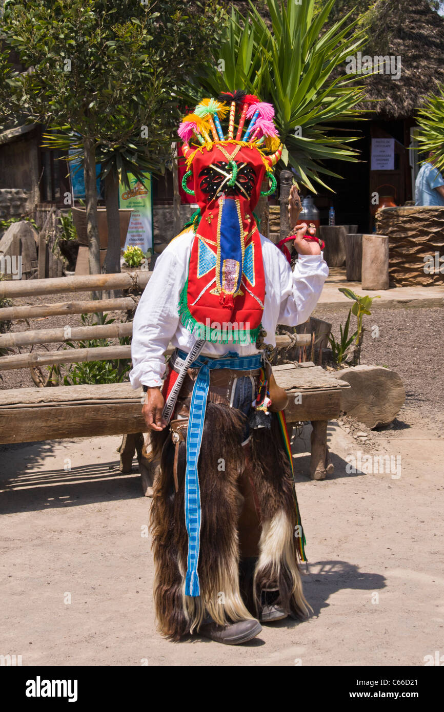 Ecuadorian native in El Diablo costume at 'Museo de Sitio Intinan' equator museum near Quito, Ecuador. Stock Photo