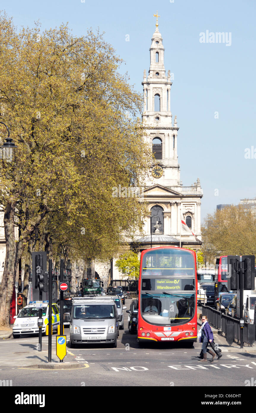 Traffic in the Strand with St Mary Le Strand spire & Church of England church now isolated in middle of the traffic in Aldwych one way road layout UK Stock Photo