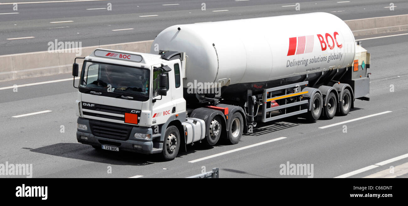 British Oxygen Company BOC liquid gas material in articulated tanker trailer and hgv lorry truck driving along London orbital M25 motorway England UK Stock Photo