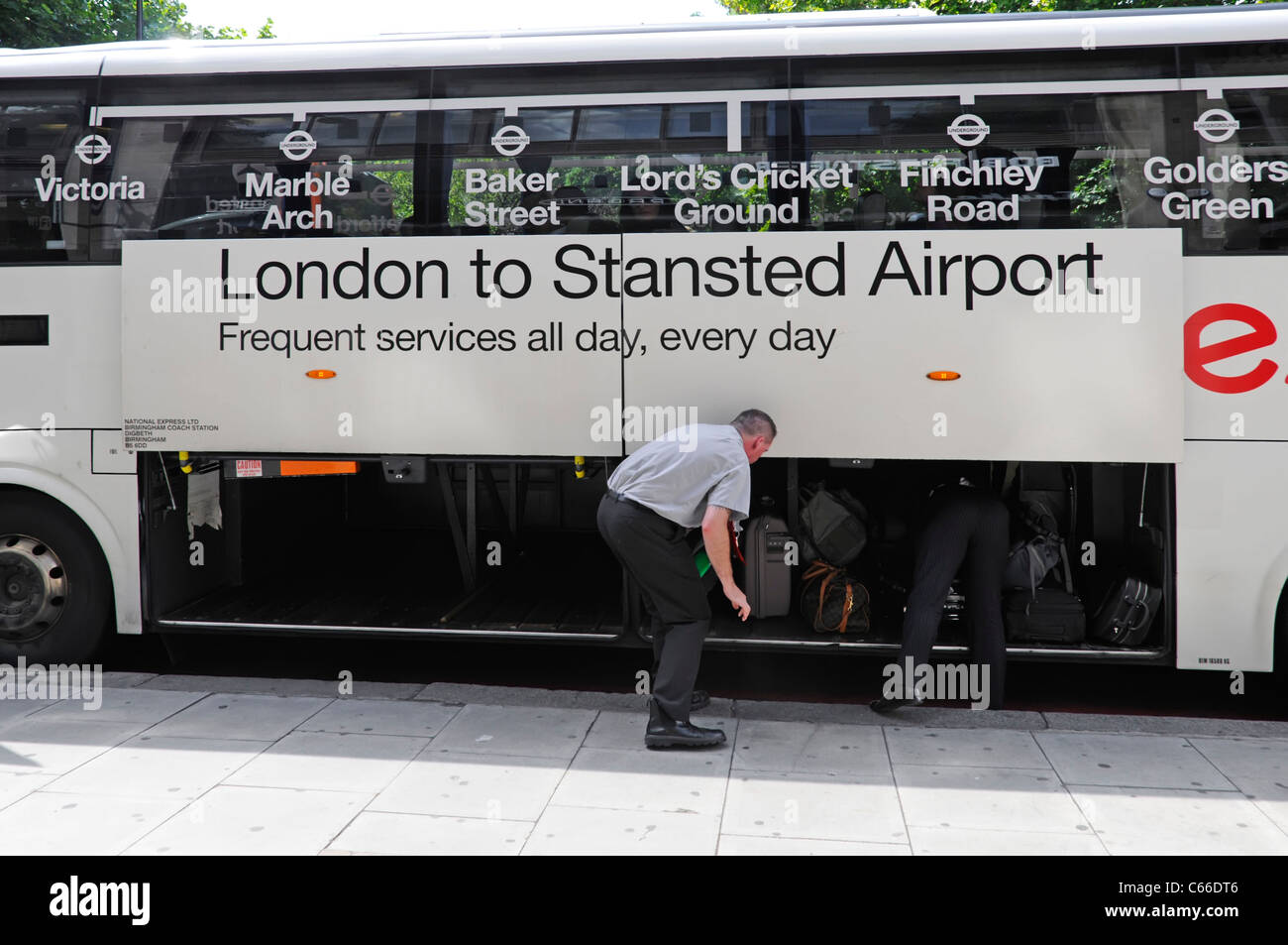 Stansted Airport National Express coach service & driver helping passenger  collecting luggage suitcase on arrival in Central London England UK Stock  Photo - Alamy
