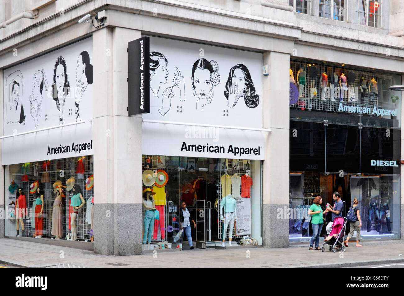 London street scene shop front of American Apparel retail clothing store business on corner shopping location Kensington High Street England UK Stock Photo