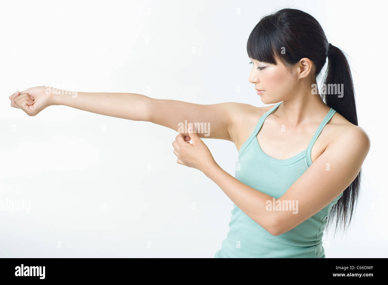 Woman Pinching Arm Stock Photo Alamy
