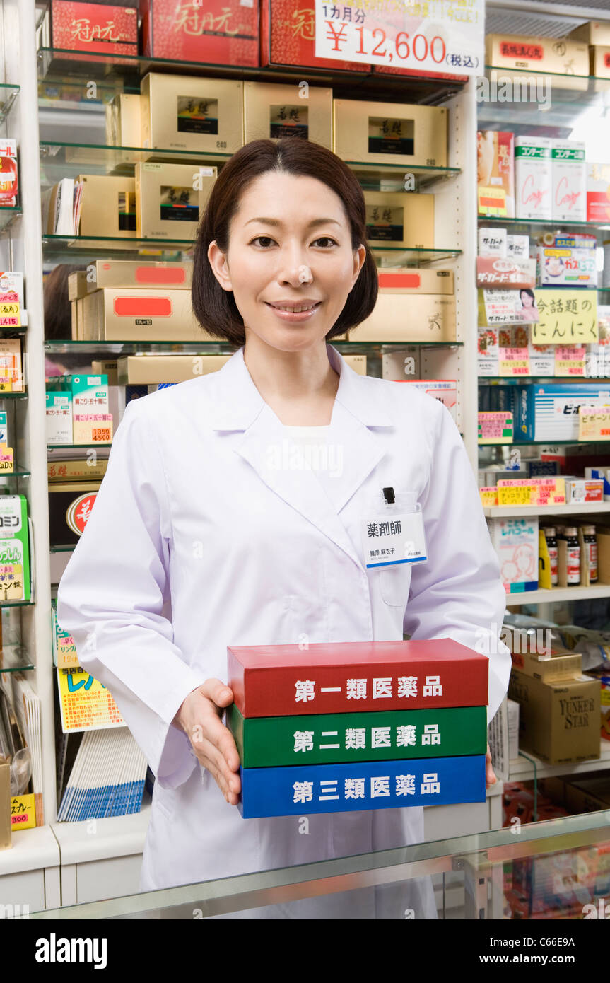 Pharmacist Holding Boxes of Classification of OTC Drugs Stock Photo Alamy