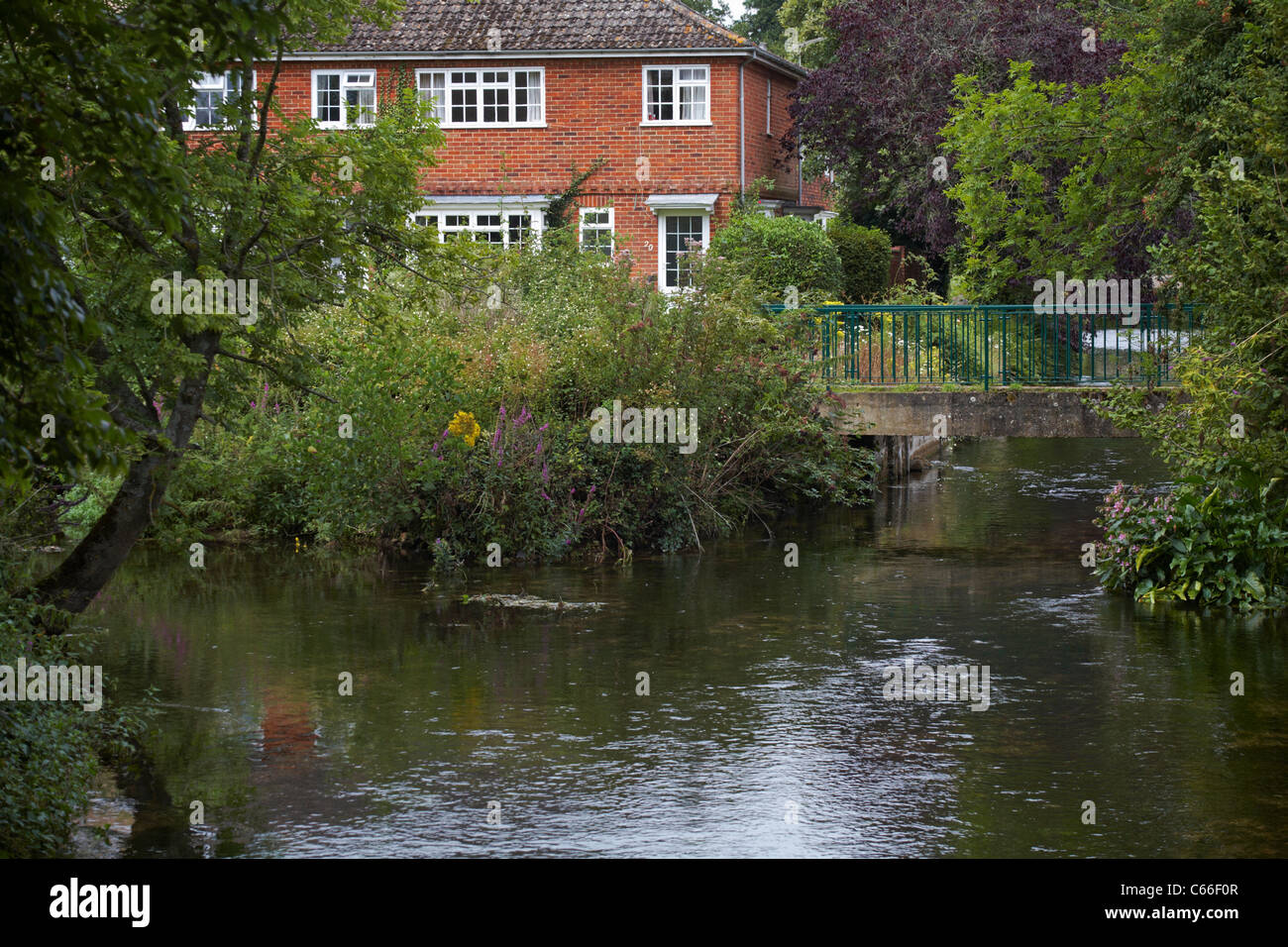Riverside houses properties by the River Test at Romsey, Hampshire, UK