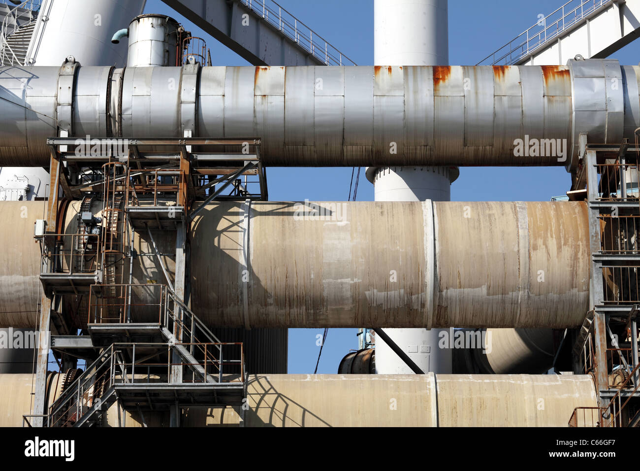 Industrial pipes on a factory and blue sky Stock Photo
