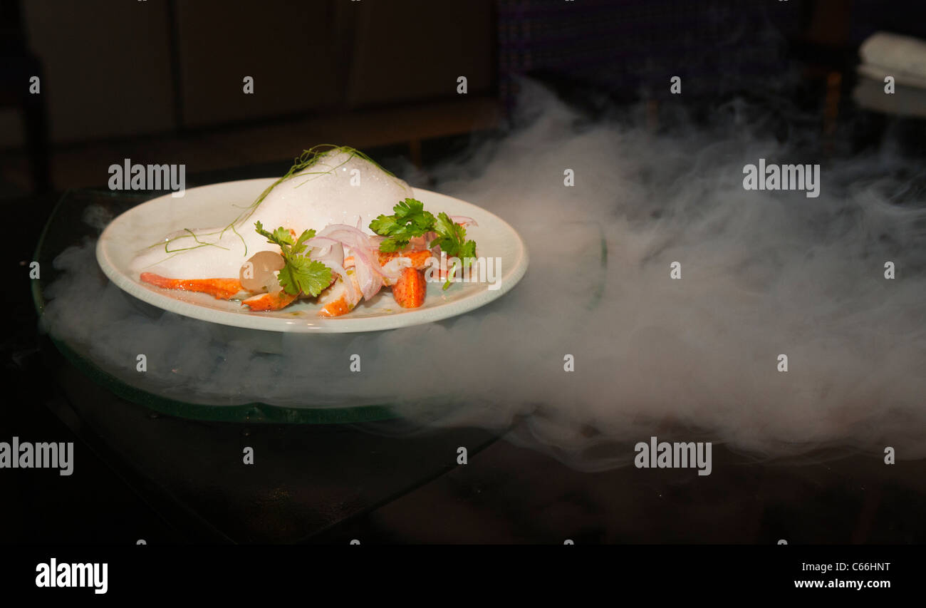 molecular gastronomy, red curry served above liquid nitrogen in Bangkok, Thailand Stock Photo