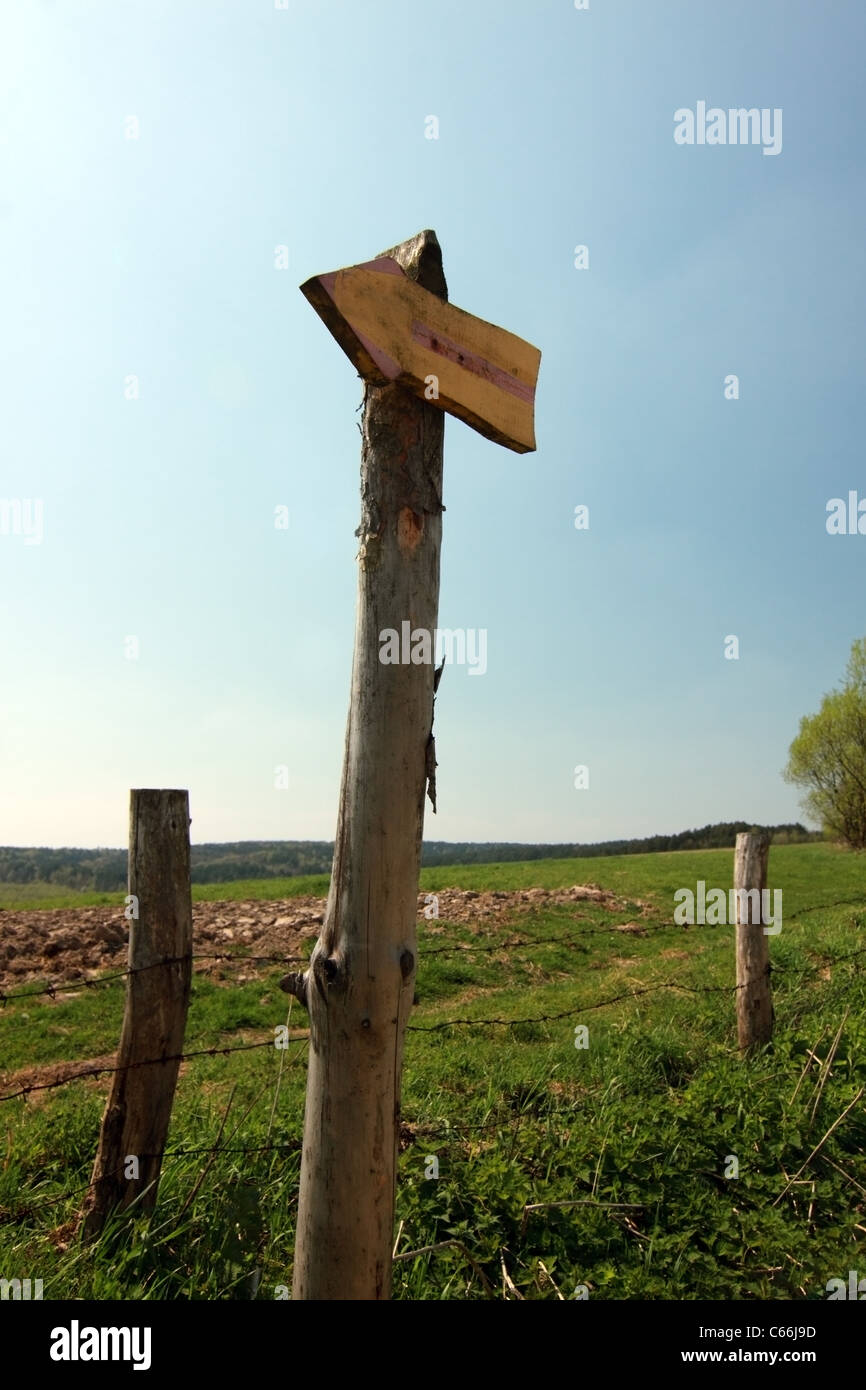 wooden direction indicator in countryside Stock Photo