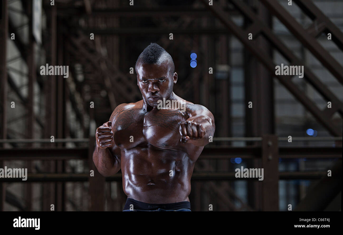 Barechested athlete punching Stock Photo Alamy