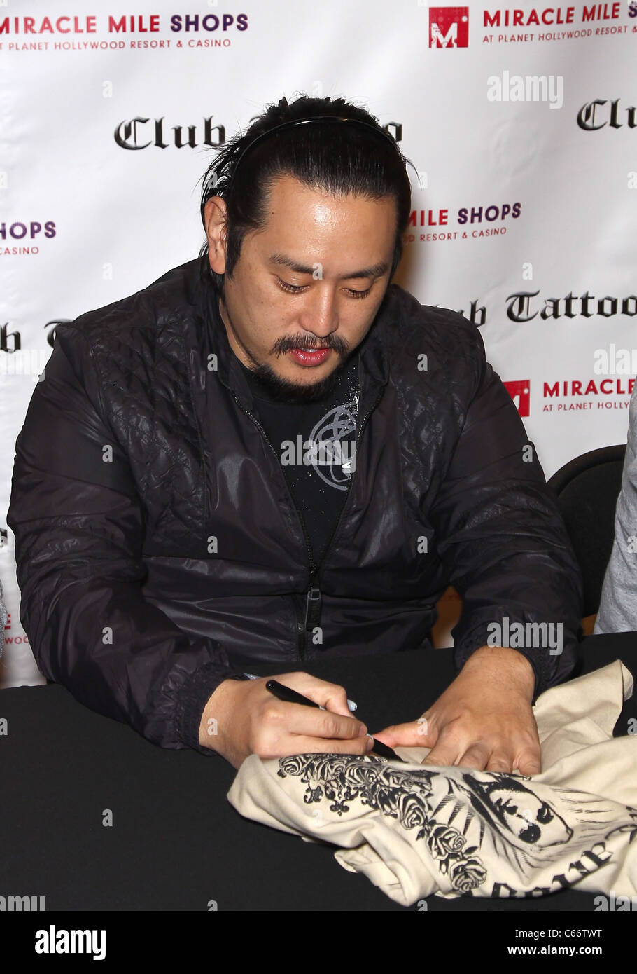 Joe Hahn in attendance for Linkin Park Autograph Signing at Club Tattoo, Miracle Mile Shops at Planet Hollywood Resort and Casino, Las Vegas, NV February 19, 2011. Photo By: MORA/Everett Collection Stock Photo