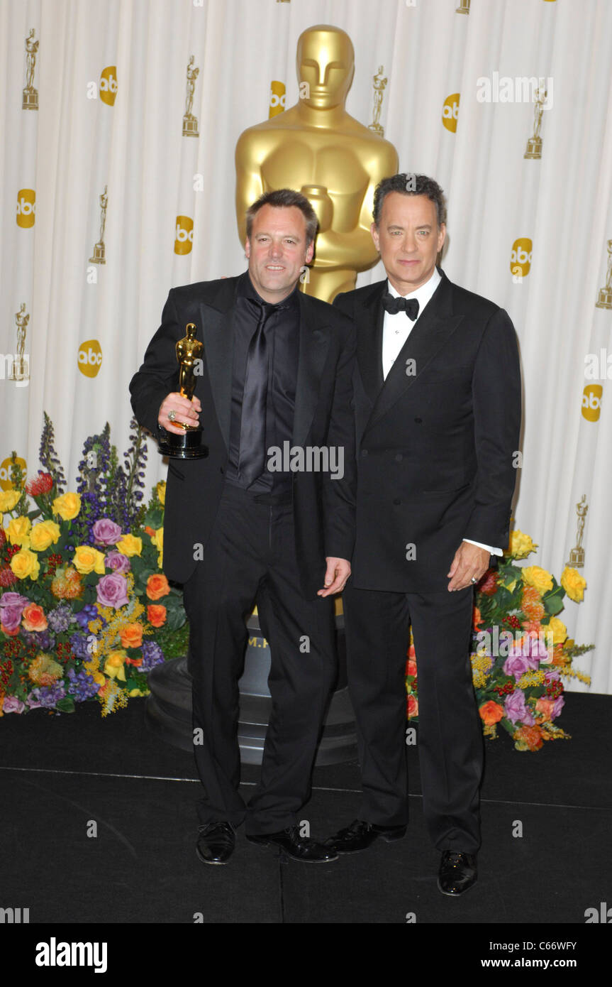 Wally Pfister (Best Achievement in Cinematography for INCEPTION), Tom Hanks in the press room for The 83rd Academy Awards Oscars - Press Room, The Kodak Theatre, Los Angeles, CA February 27, 2011. Photo By: Elizabeth Goodenough/Everett Collection Stock Photo