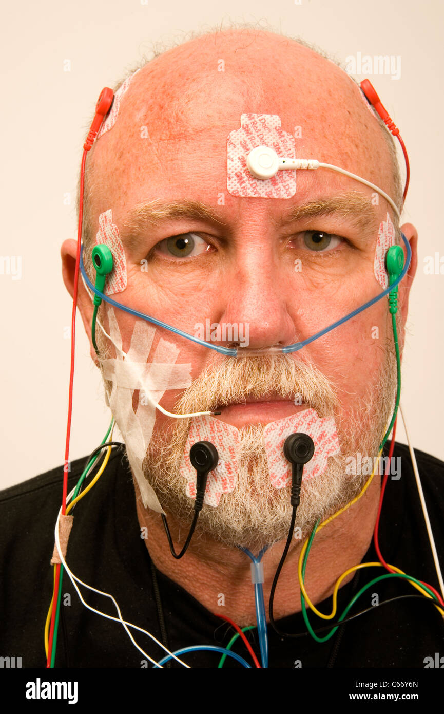 man wired for sleep apnea testing Stock Photo