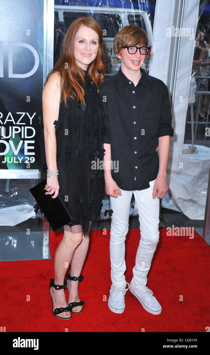 Julianne Moore, Caleb Freundlich at arrivals for Crazy, Stupid, Love. Premiere, The Ziegfeld Theatre, New York, NY July 19, 2011. Photo By: Gregorio T. Binuya/Everett Collection Stock Photo