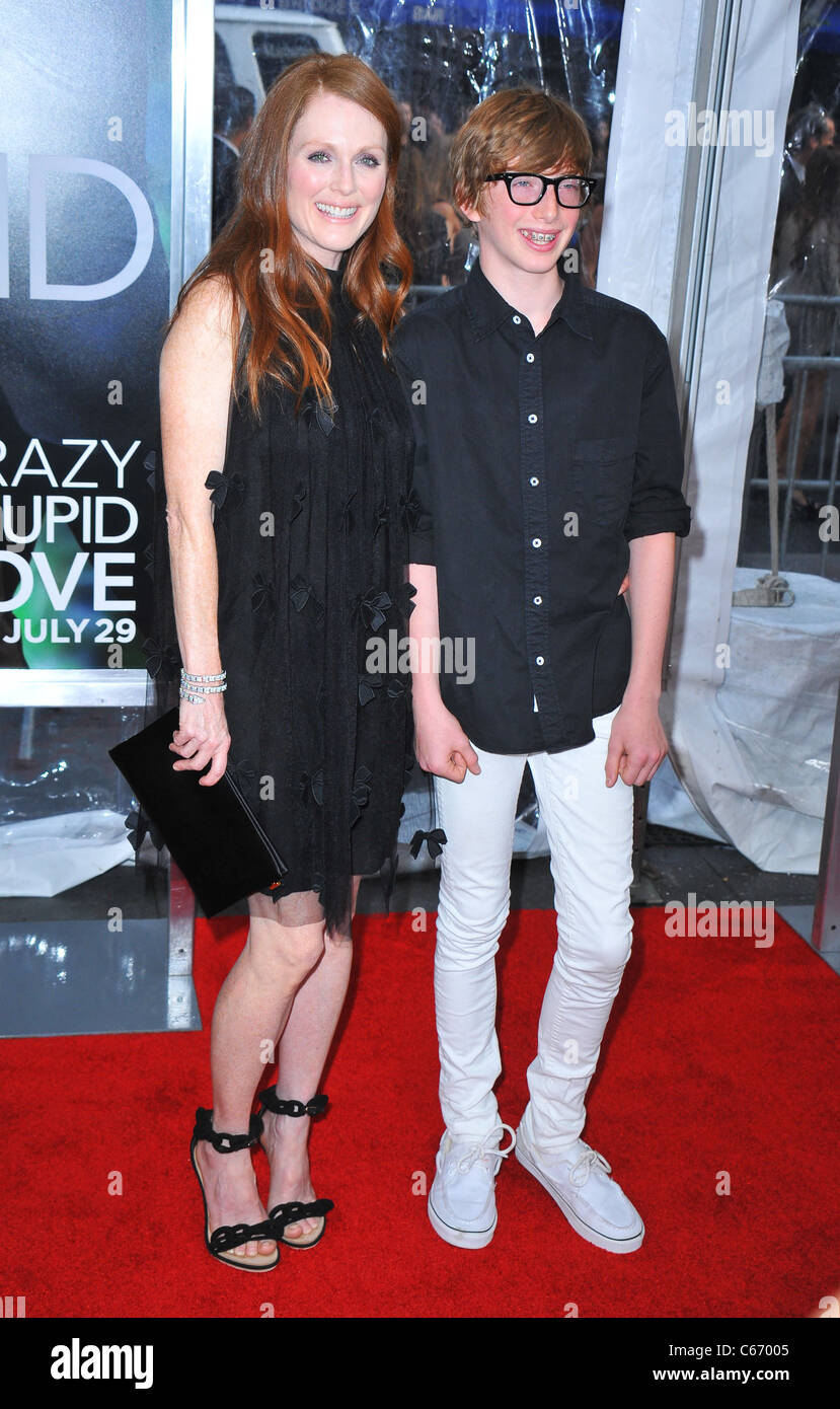Julianne Moore, Caleb Freundlich at arrivals for Crazy, Stupid, Love. Premiere, The Ziegfeld Theatre, New York, NY July 19, 2011. Photo By: Gregorio T. Binuya/Everett Collection Stock Photo