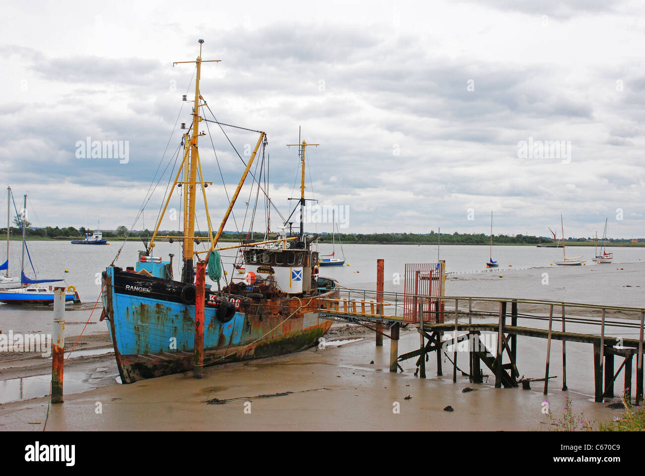 Boat moored at jetty Heybridge Basin Essex England Stock Photo Alamy