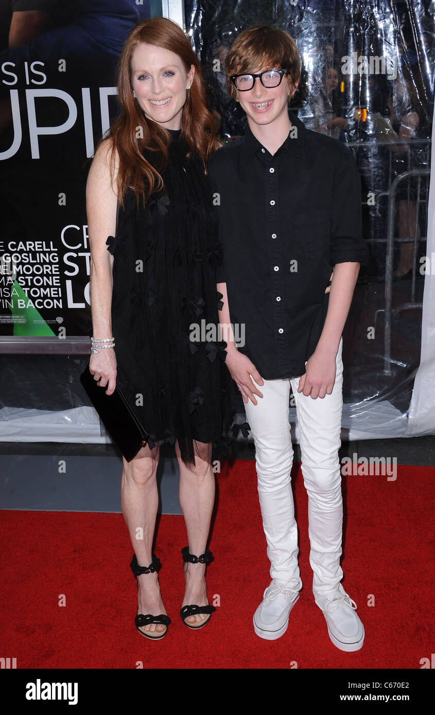 Julianne Moore, Caleb Freundlich at arrivals for Crazy, Stupid, Love. Premiere, The Ziegfeld Theatre, New York, NY July 19, 2011. Photo By: Kristin Callahan/Everett Collection Stock Photo