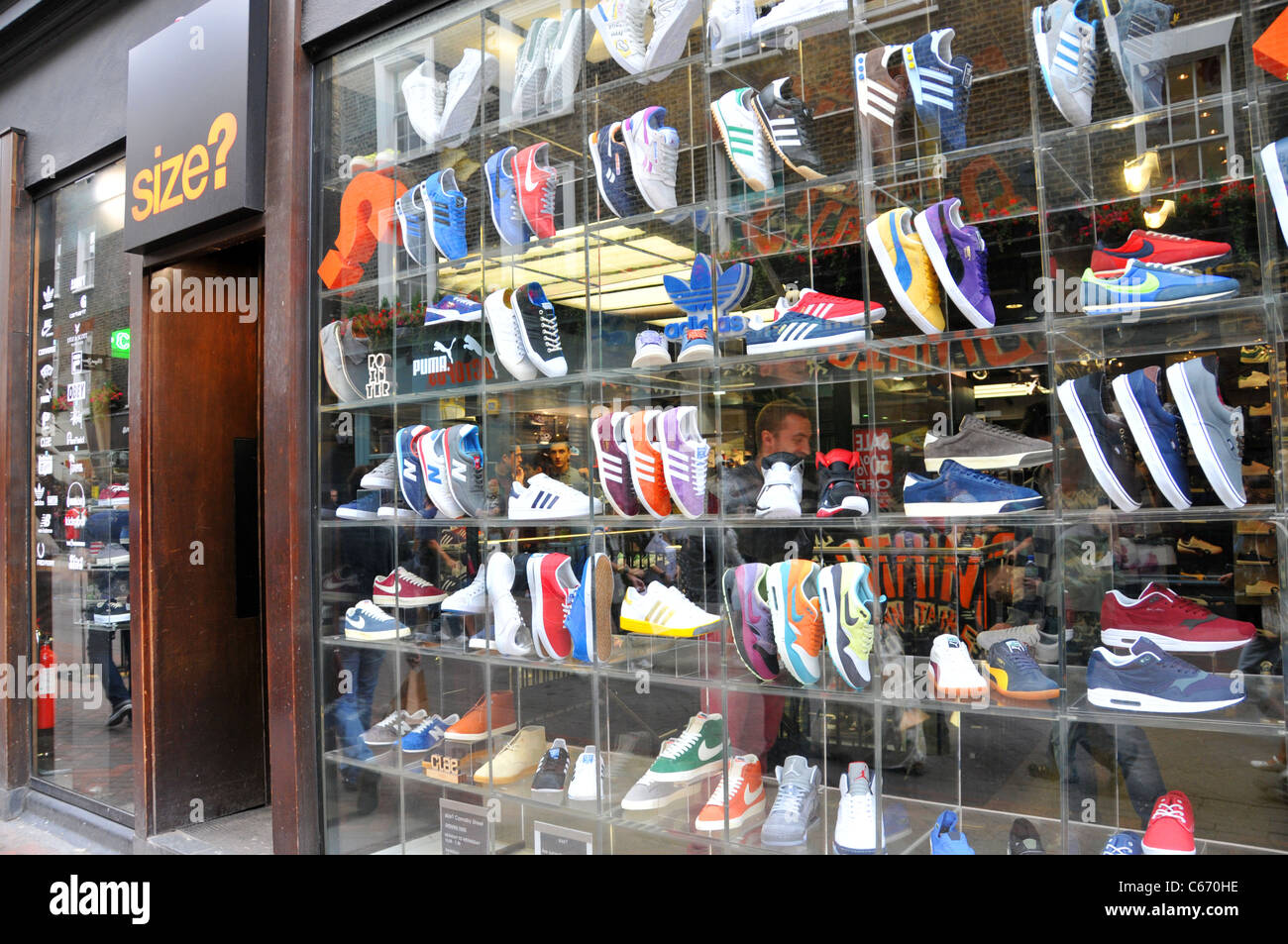 Size? shoe shop London window display Stock Photo - Alamy