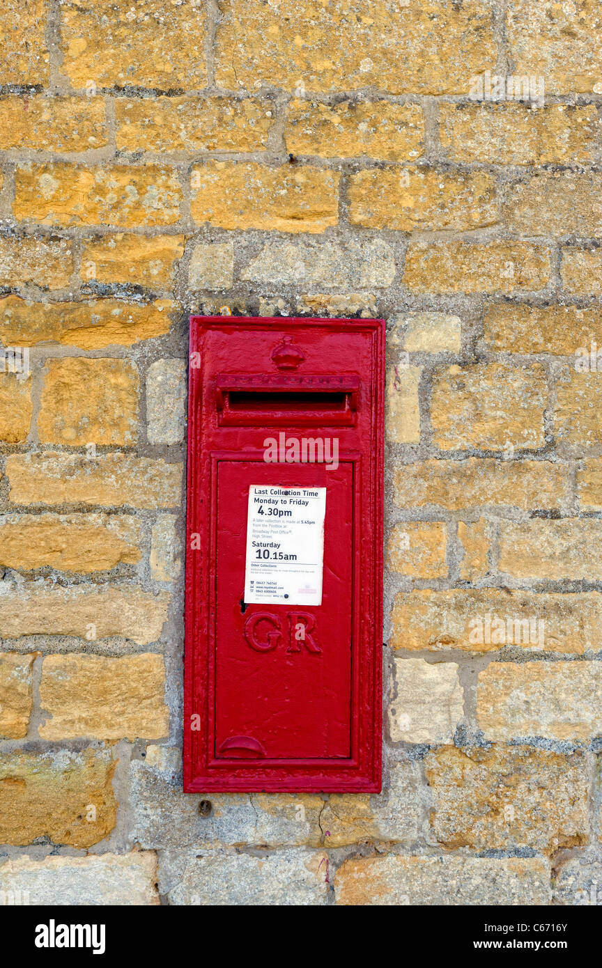 Old pillar box set into a wall in the village of Broadway in The Cotswolds, Worcestershire Stock Photo