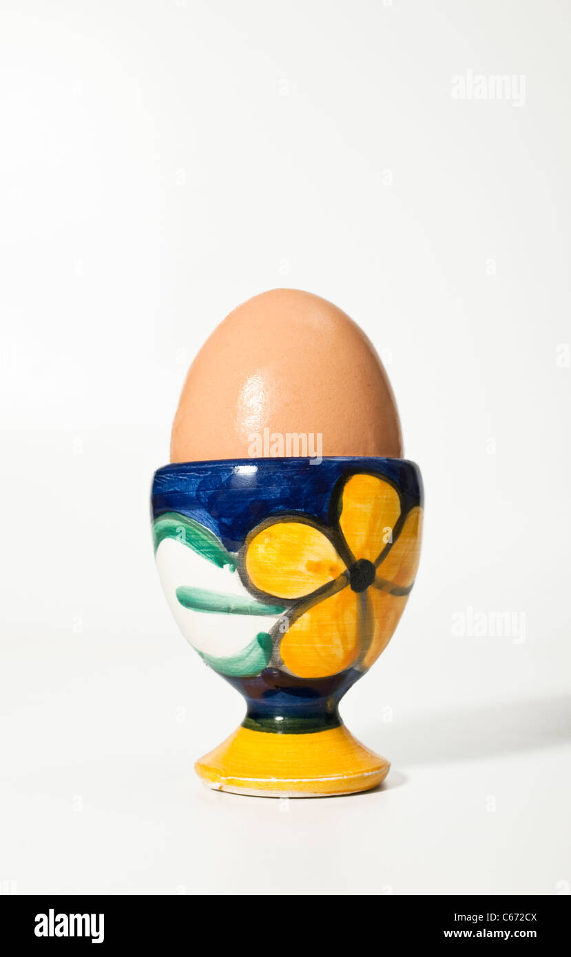 One boiled egg in a colorful eggcup Stock Photo