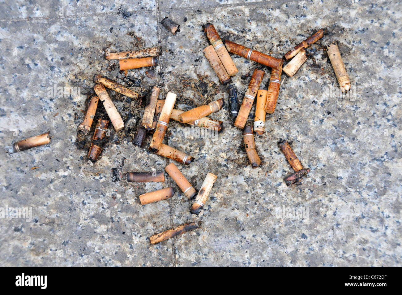 cigarette butts fag ends smoking smokers litter waste habit Stock Photo