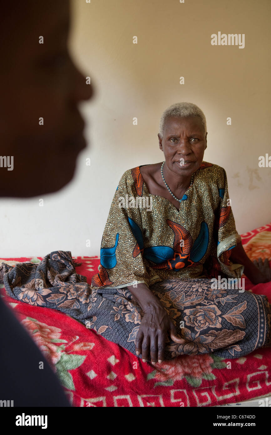 An elderly patient rests in a dormitory in Mulago Hospital in Kampala, Uganda, East Africa. Stock Photo