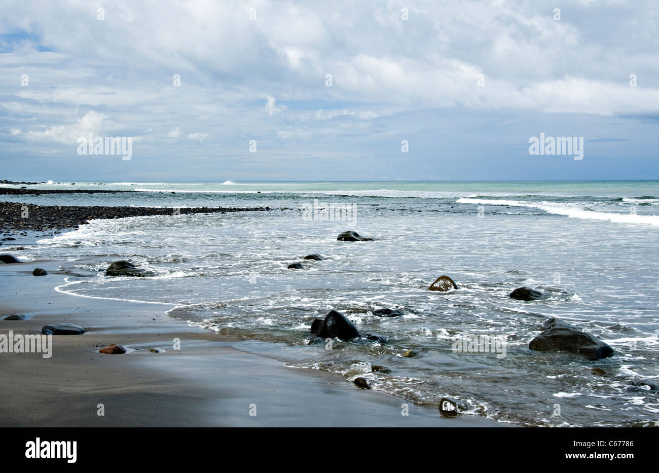The Black Volcanic Beach and Rocky Shore on the South Taranaki Bight by