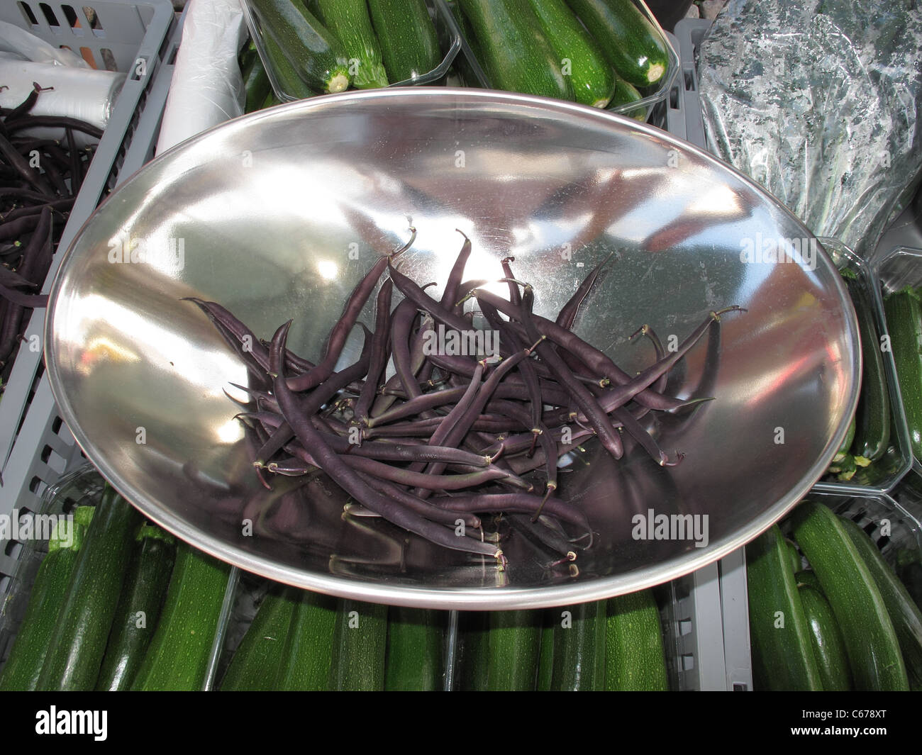 Scandinavia Turku open market street vendor stall. Purple beans sell in vegetable stall Stock Photo