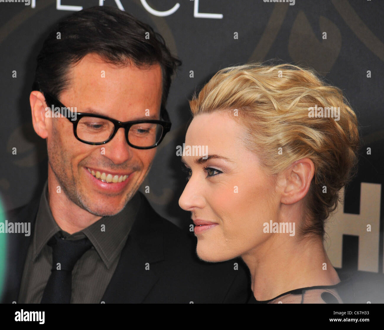Guy Pearce, Kate Winslet at arrivals for MILDRED PIERCE Premiere, The Ziegfeld Theatre, New York, NY March 21, 2011. Photo By: Gregorio T. Binuya/Everett Collection Stock Photo