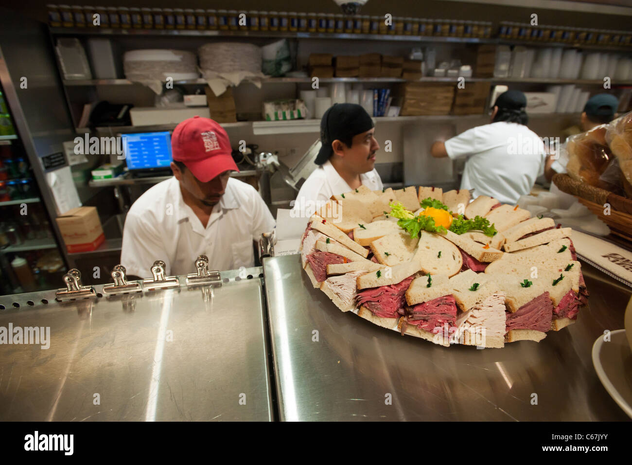Countermen at work at the grand opening of the famed 2nd Avenue Deli