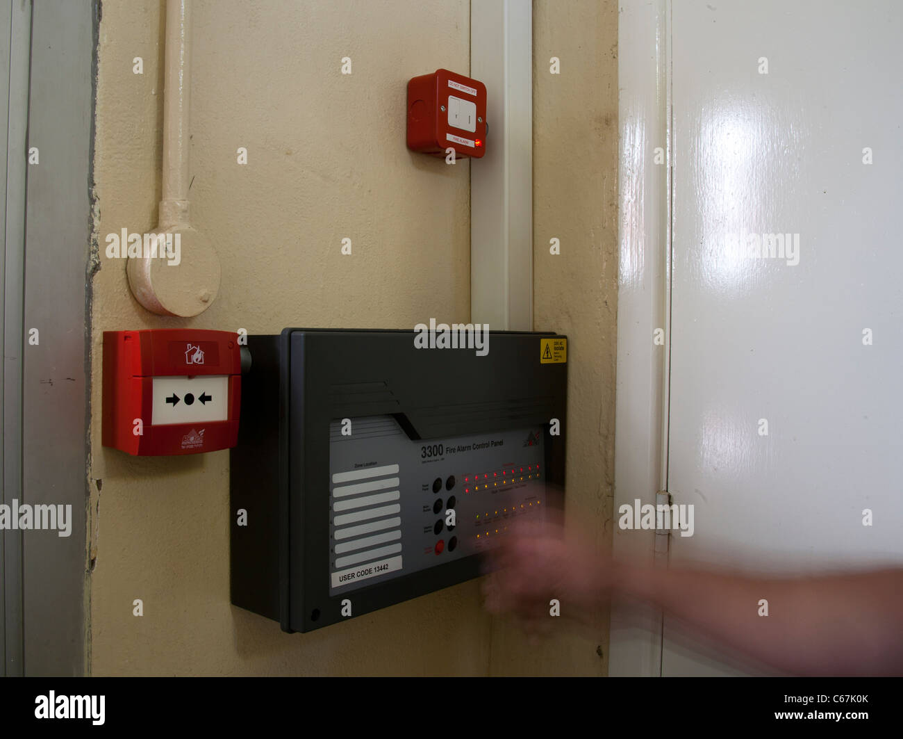 Labelled Conventional Communal EN54 Fire Alarm Control Panel with a code being entered Stock