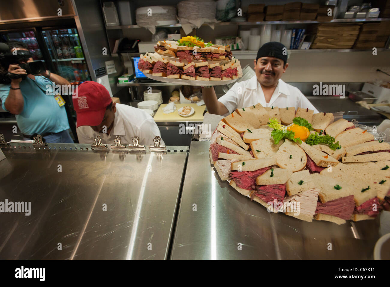 Countermen at work at the grand opening of the famed 2nd Avenue Deli