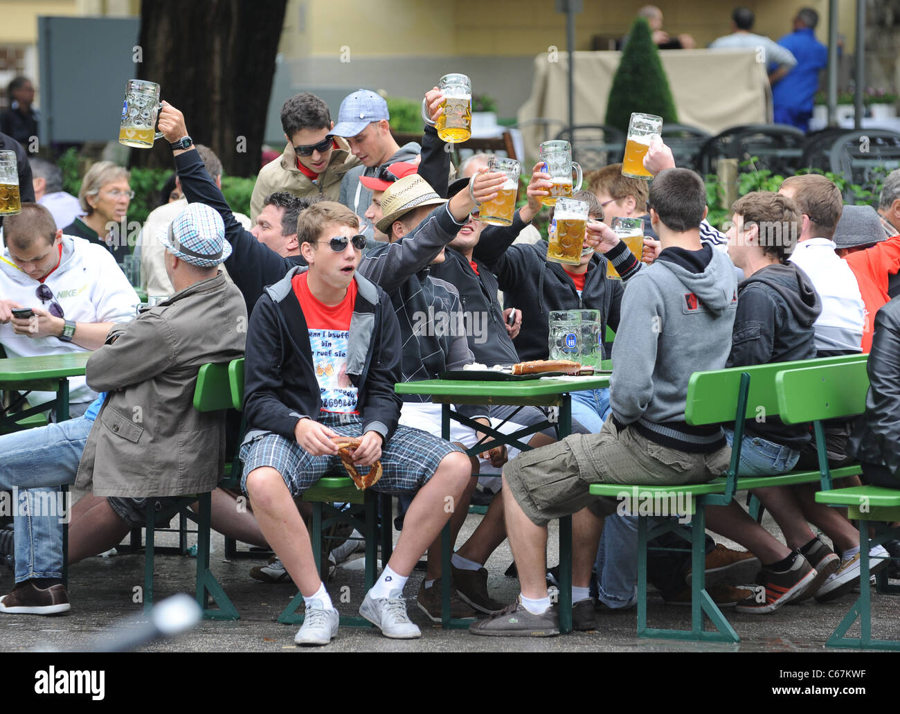 Beer drinkers in the English Garden beer garden in Munich Bavaria