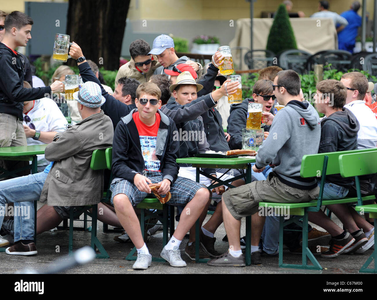 Beer drinkers in the English Garden beer garden in Munich Bavaria