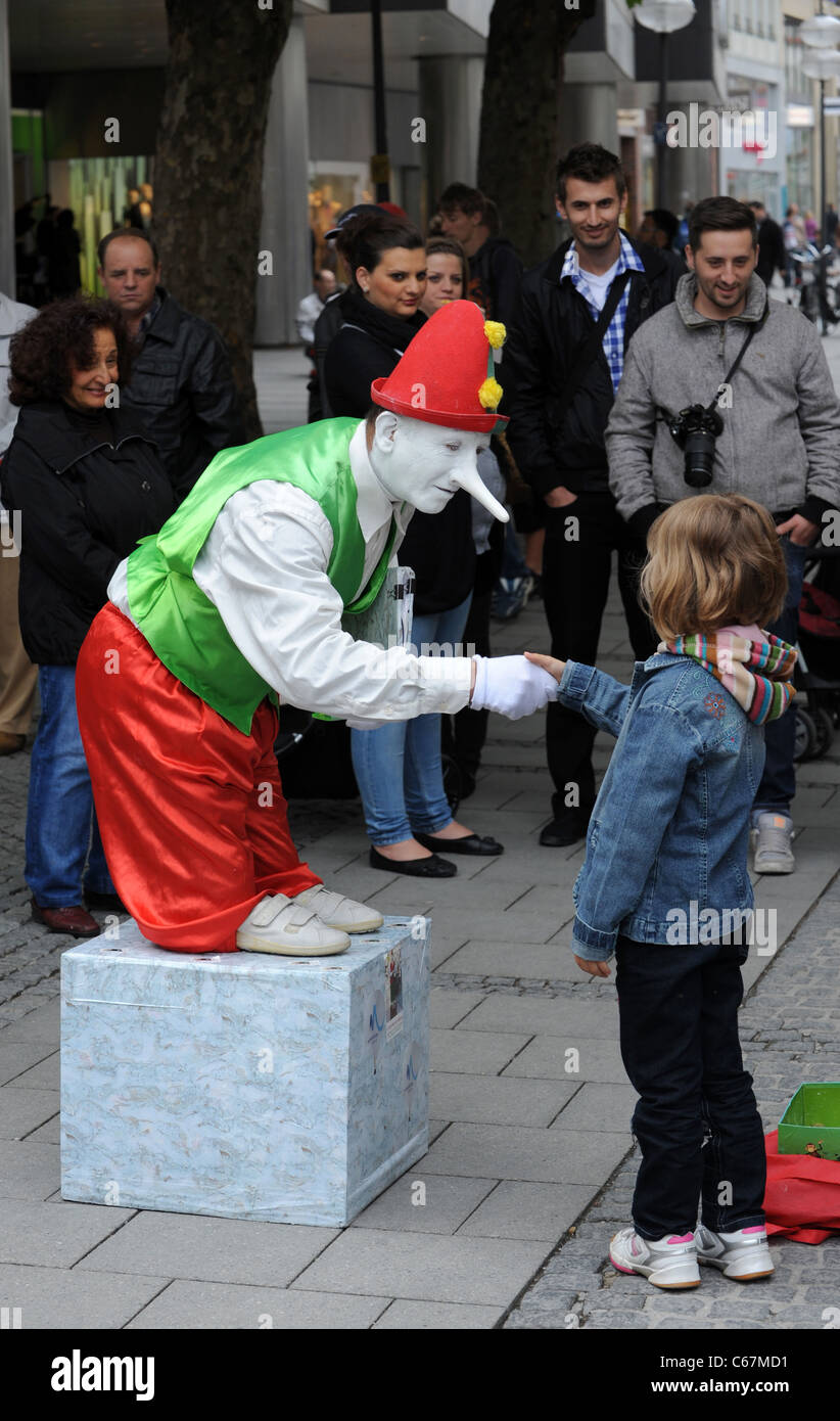 Mime artist entertaining crowds in Munich Bavaria Germany Munchen Deutschland Stock Photo