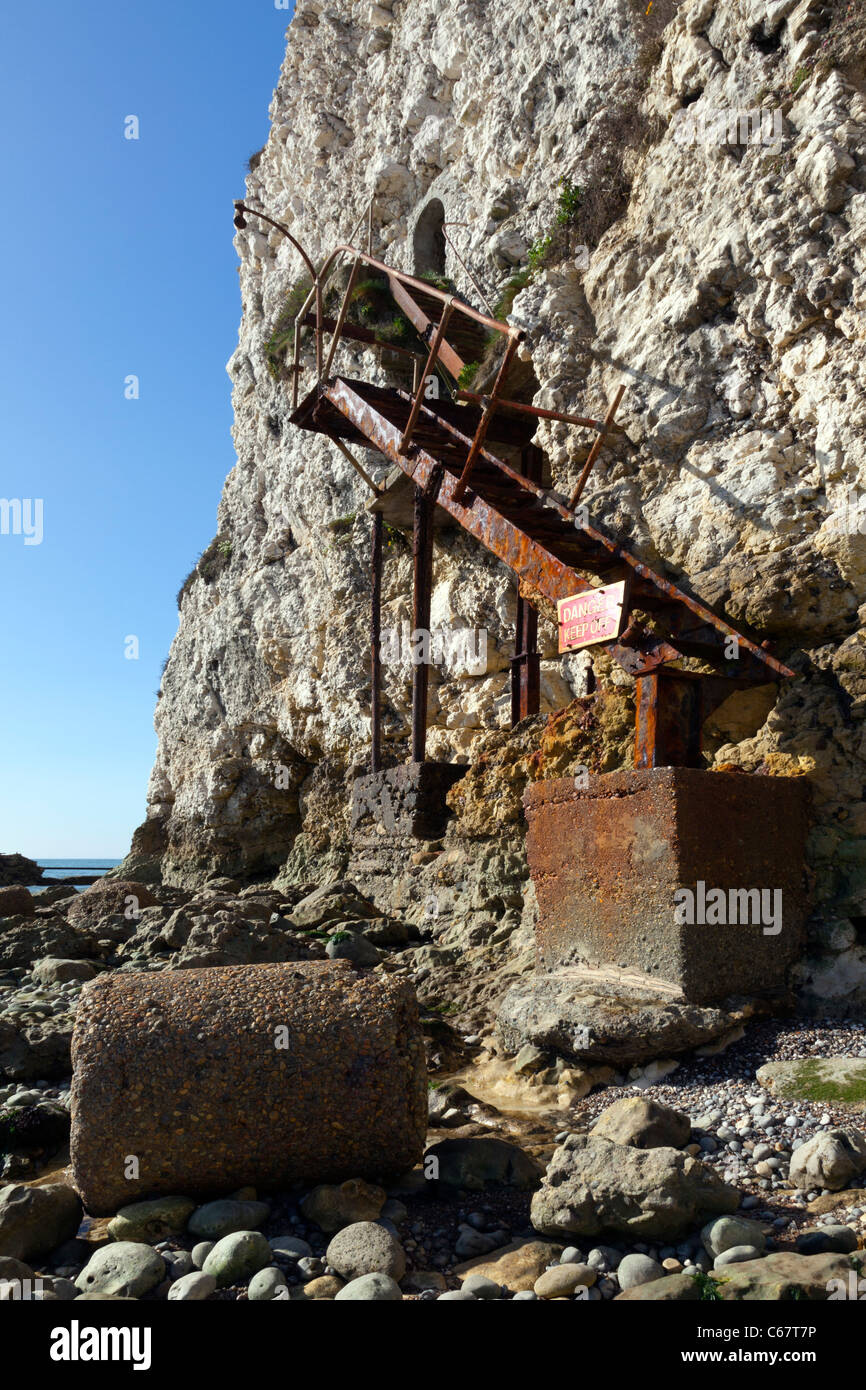 Old rusty iron stairs steps Freshwater cliff IOW Isle of Wight dangerous unstable steep chalk cliff-face entrance doorway Stock Photo