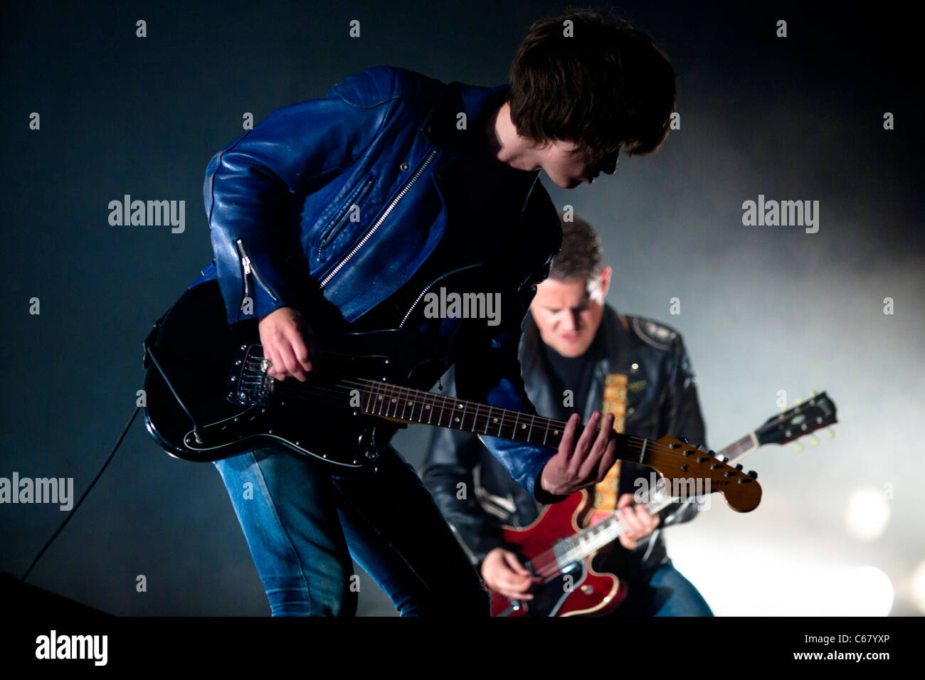 The Artic Monkeys guitarists playing live on stage at FIB Benicassim - july 2011 Stock Photo