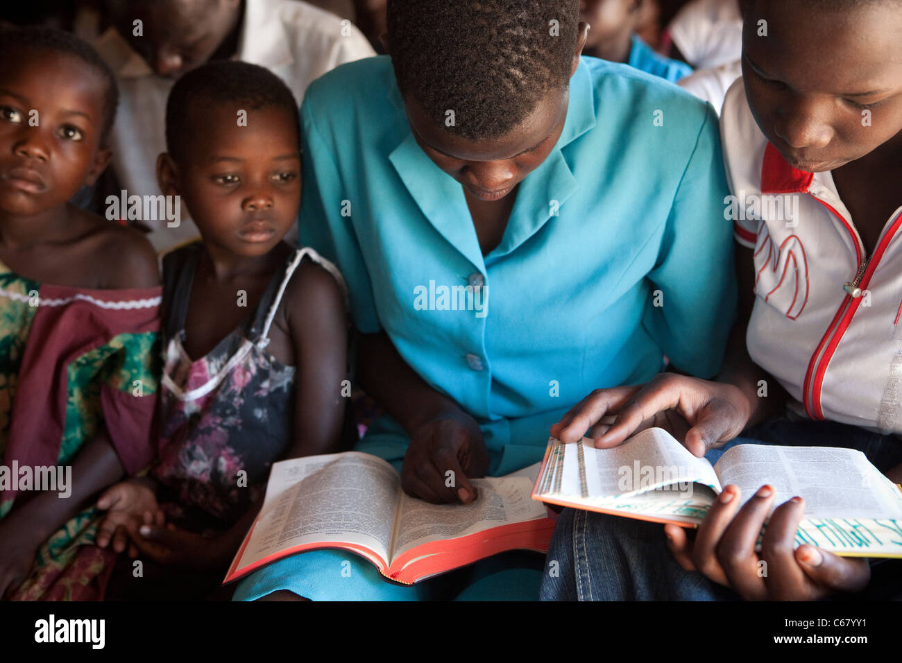 Churchgoers study the Bible at a church service in Amuria, Uganda, East Africa. Stock Photo