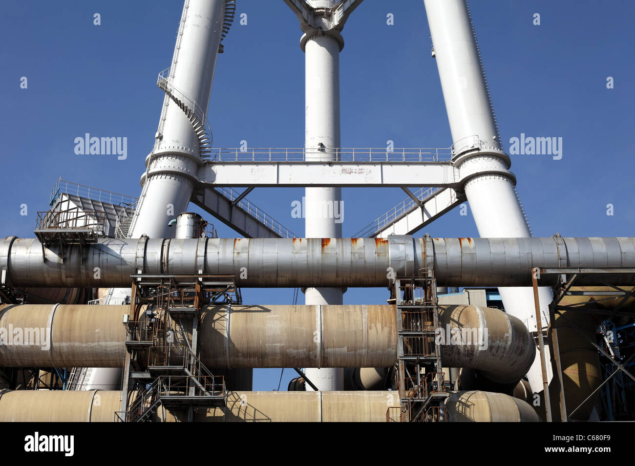 Industrial pipes on a factory and blue sky Stock Photo