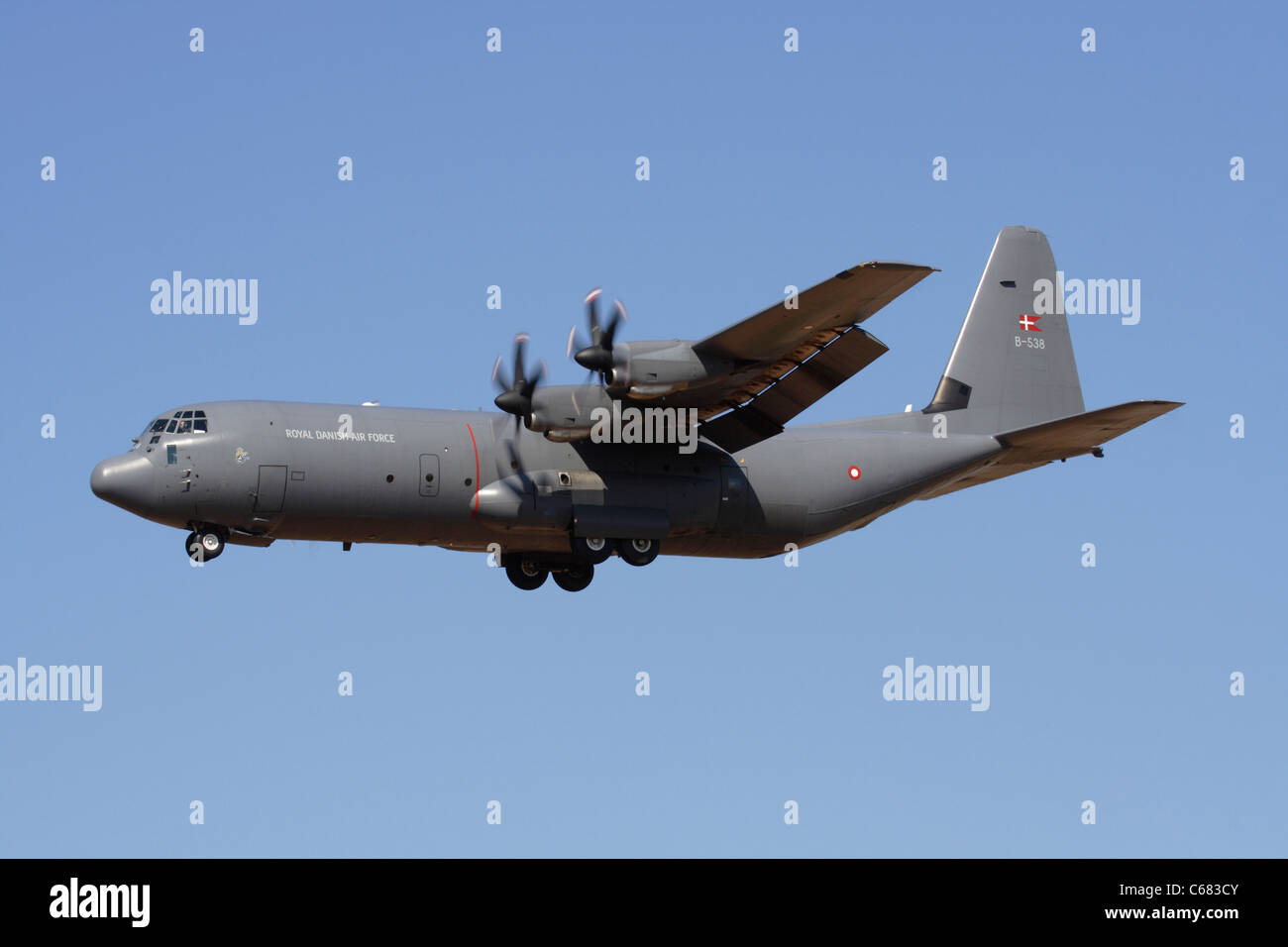 Military aviation. Lockheed Martin C-130J-30 Hercules cargo plane of the Royal Danish Air Force on final approach Stock Photo